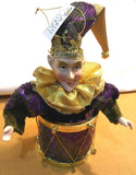 JESTER FIGURINE ON DRUM