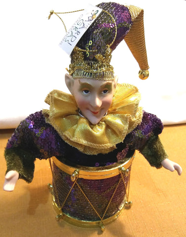 JESTER FIGURINE ON DRUM