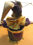 JESTER FIGURINE ON DRUM
