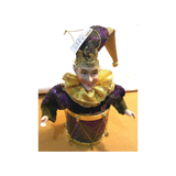 JESTER FIGURINE ON DRUM
